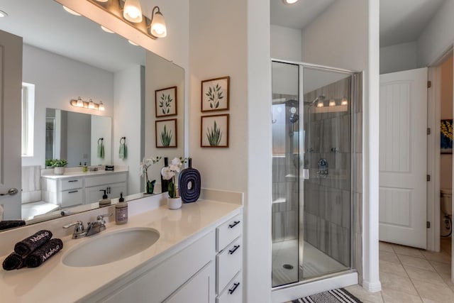 1314 Overture Pl, Round Rock, TX 78681 - bathroom with a shower stall, tile patterned floors, and vanity