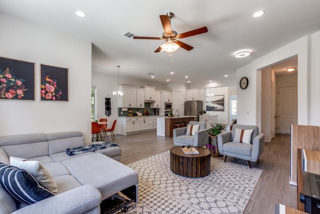 1314 Overture Pl, Round Rock, TX 78681 - living area featuring ceiling fan, light wood-style flooring, and recessed lighting
