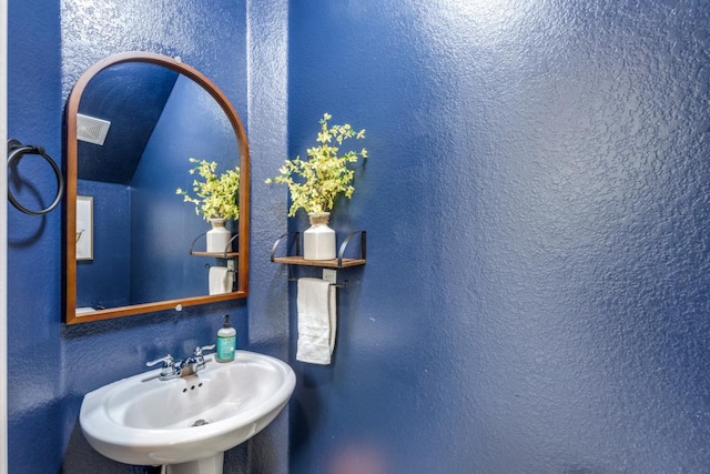 1314 Overture Pl, Round Rock, TX 78681 - bathroom featuring a sink and a textured wall