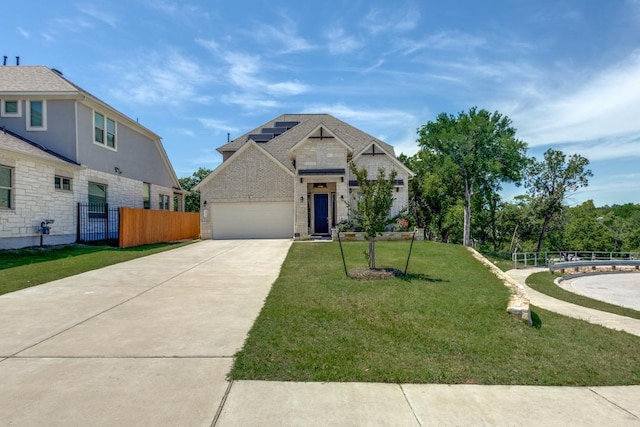 1314 Overture Pl, Round Rock, TX 78681 - view of front of home featuring concrete driveway, a garage, solar panels, and brick siding