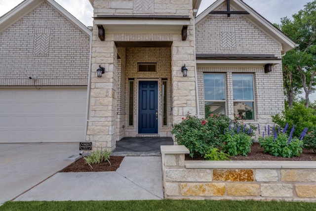 1314 Overture Pl, Round Rock, TX 78681 - entrance to property featuring concrete driveway, a garage, and stone siding