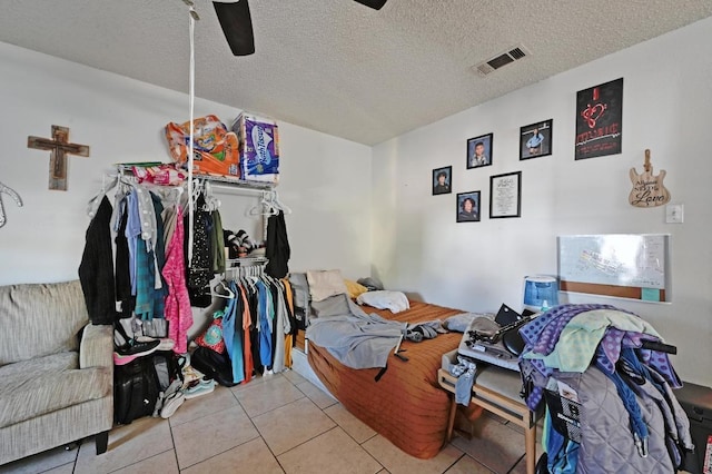 5405 Rose Hill Cir, Austin, TX 78745 - tiled bedroom with a textured ceiling and a ceiling fan