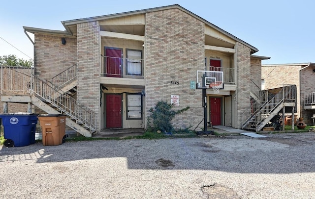 5405 Rose Hill Cir, Austin, TX 78745 - view of front of home featuring stairway and brick siding
