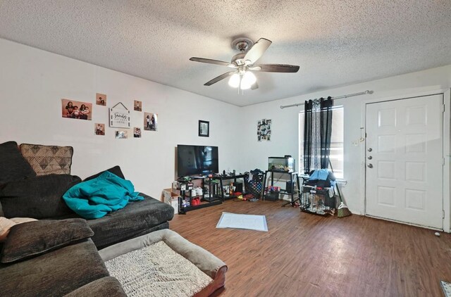 5405 Rose Hill Cir, Austin, TX 78745 - living room with wood finished floors, ceiling fan, and a textured ceiling