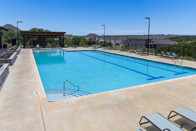 1704 Plum Tree Way, Georgetown, TX 78628 - community pool with a residential view, a patio, and a pergola