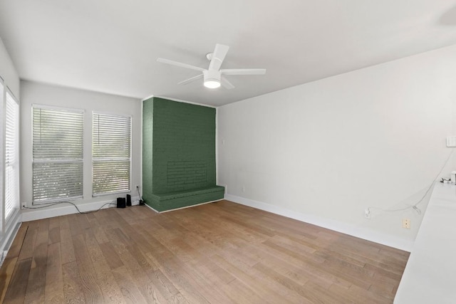 909 Reinli St Unit 101, Austin, TX 78751 - spare room featuring a ceiling fan, wood finished floors, and baseboards