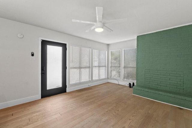 909 Reinli St Unit 101, Austin, TX 78751 - spare room featuring ceiling fan, baseboards, light wood finished floors, and a smoke detector
