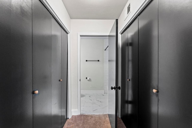 909 Reinli St Unit 101, Austin, TX 78751 - hallway with baseboards and marble finish floors