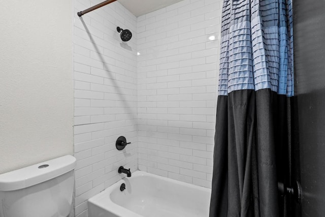909 Reinli St Unit 101, Austin, TX 78751 - full bathroom featuring shower / bath combination with curtain, toilet, and a textured wall
