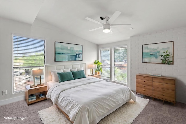909 Reinli St Unit 101, Austin, TX 78751 - bedroom featuring carpet, lofted ceiling, and a ceiling fan