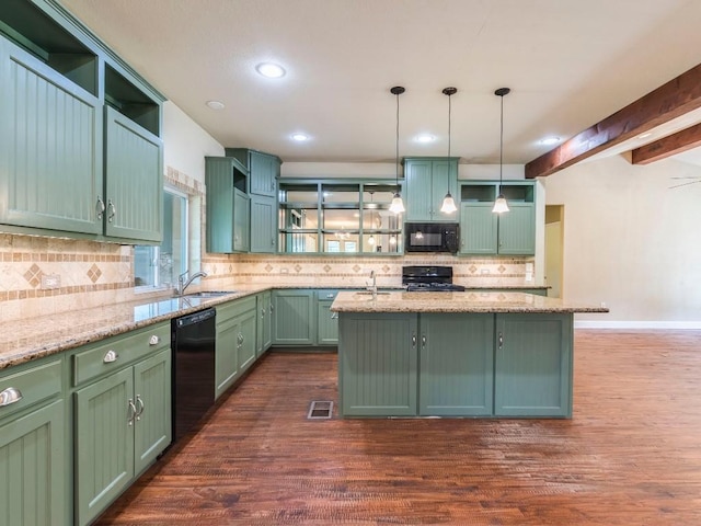 119 E Wiamea Ct, Bastrop, TX 78602 - kitchen with black appliances, open shelves, green cabinetry, dark wood-style flooring, and decorative backsplash