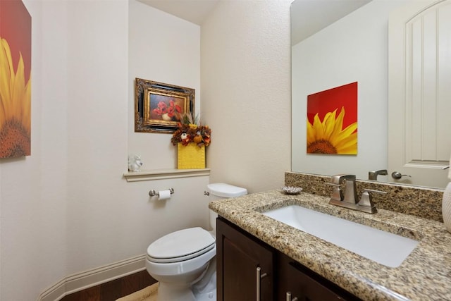 100 Royal Oak Dr, Georgetown, TX 78628 - bathroom with toilet, vanity, and wood finished floors