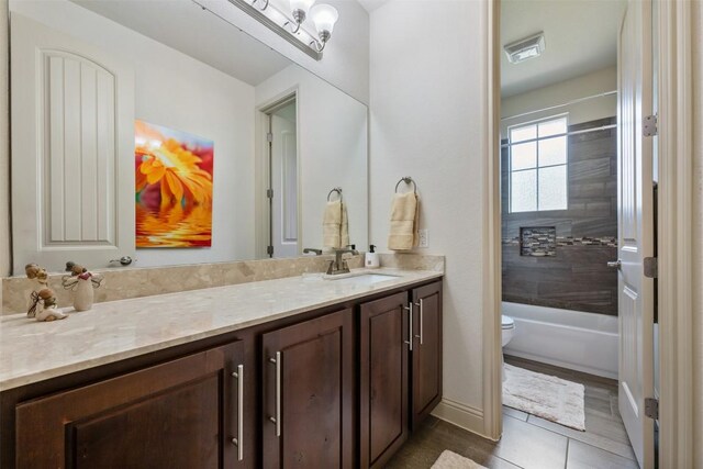 100 Royal Oak Dr, Georgetown, TX 78628 - full bath with toilet, vanity, tile patterned flooring, and shower / tub combination