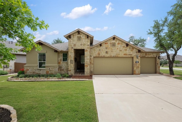 100 Royal Oak Dr, Georgetown, TX 78628 - view of front of house with stone siding, an attached garage, a front lawn, concrete driveway, and stucco siding