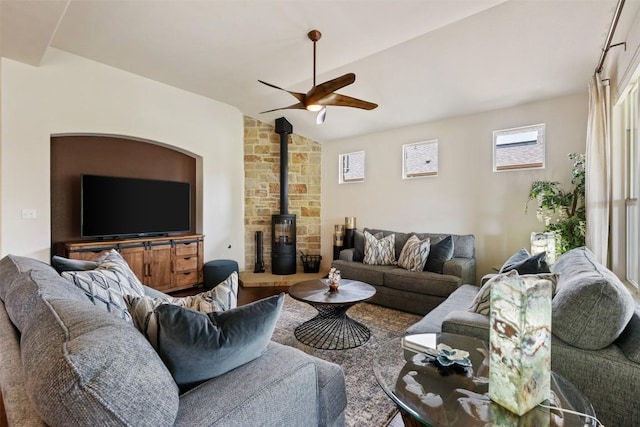 100 Royal Oak Dr, Georgetown, TX 78628 - living area featuring a ceiling fan, a wood stove, and lofted ceiling