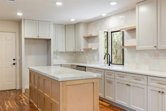 kitchen with open shelves, a sink, a kitchen island, dark wood-style flooring, and recessed lighting