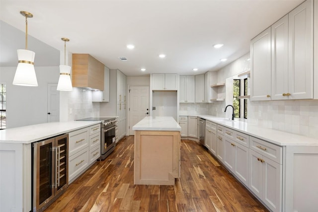 kitchen with stainless steel appliances, beverage cooler, wall chimney exhaust hood, dark wood-style floors, and tasteful backsplash