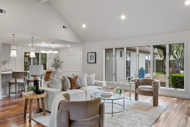 210 Hazeltine Dr, Lakeway, TX 78734 - living area featuring high vaulted ceiling, light wood-style flooring, recessed lighting, beam ceiling, and baseboards