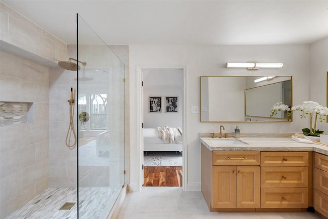 210 Hazeltine Dr, Lakeway, TX 78734 - full bath featuring a tile shower, vanity, connected bathroom, and tile patterned floors