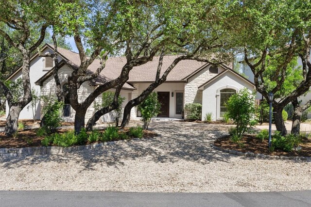 210 Hazeltine Dr, Lakeway, TX 78734 - view of front of property with stone siding