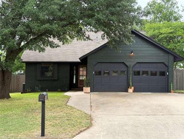 view of front of house with concrete driveway and a garage