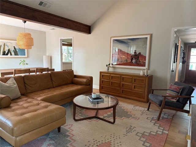 living area with wood finished floors and baseboards