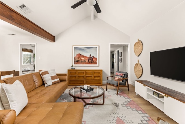 living area featuring a ceiling fan, wood finished floors, and baseboards