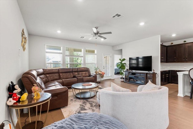 128 Green Knoll Ln, Georgetown, TX 78628 - living room featuring a ceiling fan, light wood-style flooring, and recessed lighting