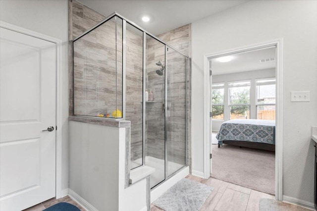 128 Green Knoll Ln, Georgetown, TX 78628 - ensuite bathroom featuring a shower stall, vanity, and recessed lighting