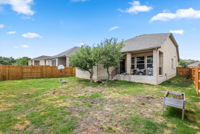 128 Green Knoll Ln, Georgetown, TX 78628 - back of house featuring brick siding and a fenced backyard