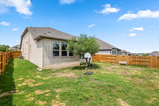 128 Green Knoll Ln, Georgetown, TX 78628 - rear view of property with brick siding and a fenced backyard