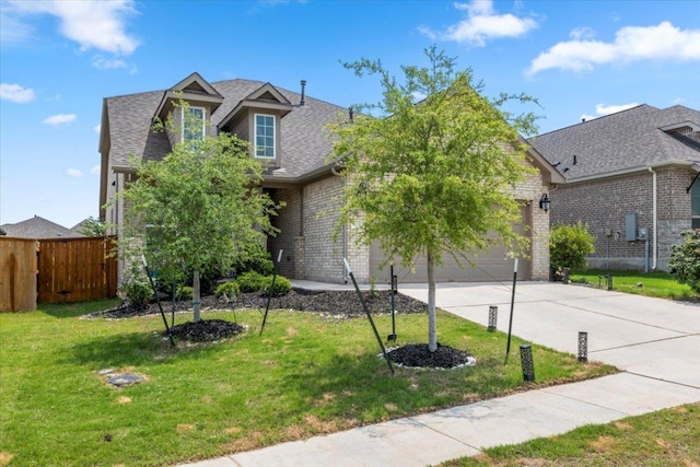 128 Green Knoll Ln, Georgetown, TX 78628 - view of front of house with concrete driveway, an attached garage, brick siding, and roof with shingles