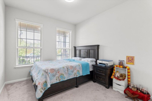 128 Green Knoll Ln, Georgetown, TX 78628 - bedroom featuring light carpet and baseboards