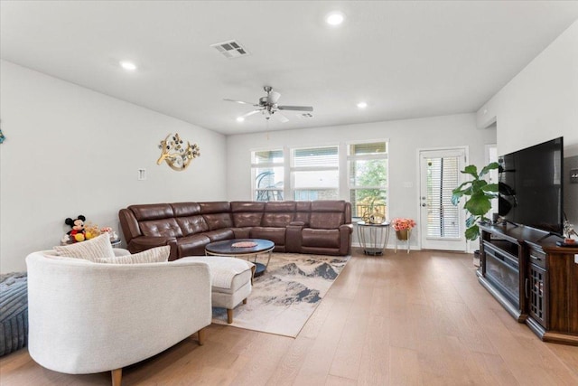 128 Green Knoll Ln, Georgetown, TX 78628 - living area featuring a ceiling fan, wood finished floors, and recessed lighting