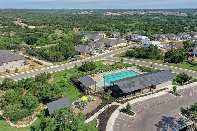128 Green Knoll Ln, Georgetown, TX 78628 - aerial view of residential area featuring a pool area and a heavily wooded area