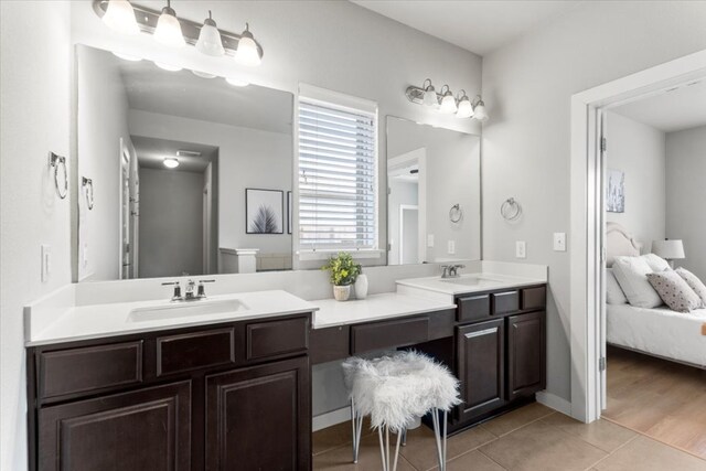 7207 Auburn Blaze Ln, Austin, TX 78744 - ensuite bathroom featuring double vanity and tile patterned flooring