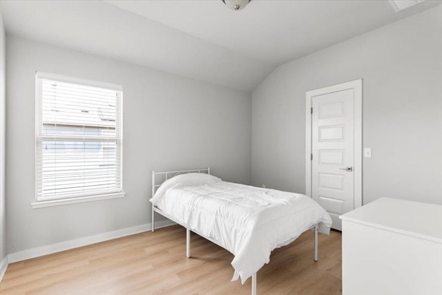 7207 Auburn Blaze Ln, Austin, TX 78744 - bedroom with light wood finished floors and vaulted ceiling