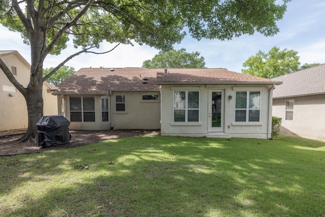 113 Warbler Way, Georgetown, TX 78633 - back of house with a yard, stucco siding, and roof with shingles
