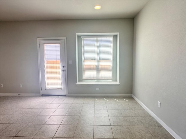 137 Rustic Glen Dr, San Marcos, TX 78666 - spare room with light tile patterned floors, baseboards, and recessed lighting