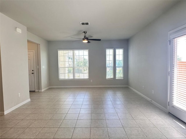 137 Rustic Glen Dr, San Marcos, TX 78666 - unfurnished room featuring light tile patterned flooring, ceiling fan, and baseboards