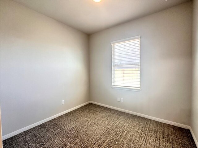 137 Rustic Glen Dr, San Marcos, TX 78666 - empty room with carpet floors and baseboards