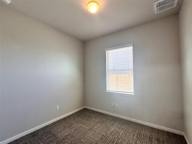 137 Rustic Glen Dr, San Marcos, TX 78666 - empty room with baseboards and dark carpet