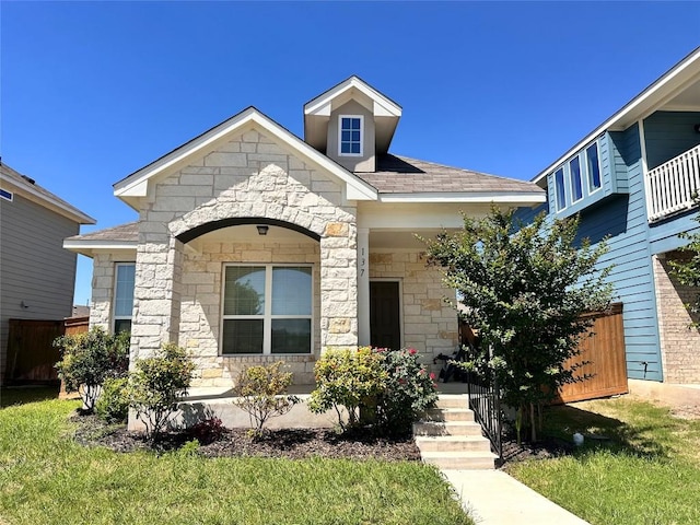 137 Rustic Glen Dr, San Marcos, TX 78666 - view of front of property featuring stone siding, covered porch, and roof with shingles