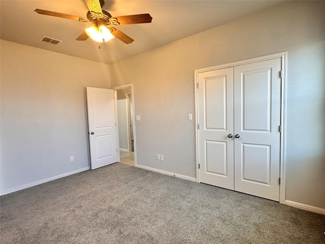 137 Rustic Glen Dr, San Marcos, TX 78666 - unfurnished bedroom featuring carpet flooring, baseboards, a closet, and a ceiling fan