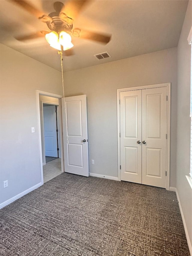 137 Rustic Glen Dr, San Marcos, TX 78666 - unfurnished bedroom with carpet floors, baseboards, a closet, and ceiling fan