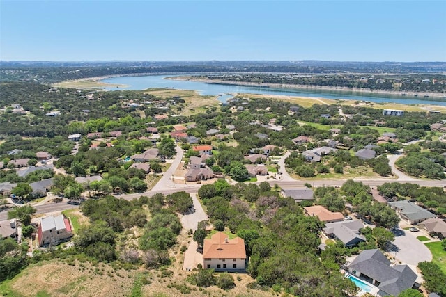 aerial view of residential area featuring a nearby body of water
