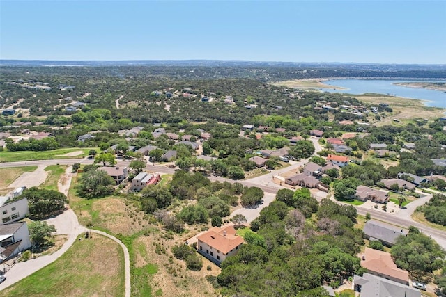 aerial view of residential area with a large body of water