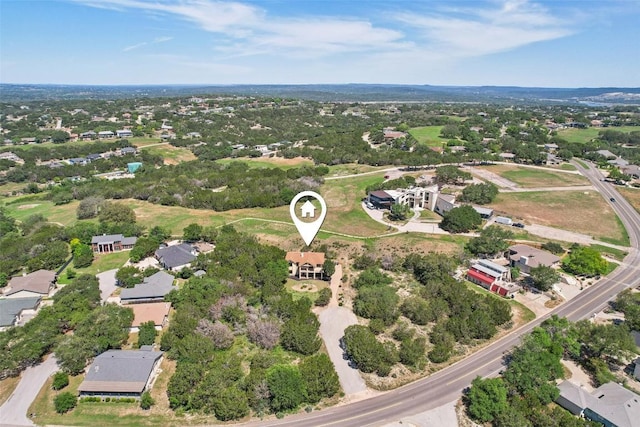 aerial view of property's location with nearby suburban area