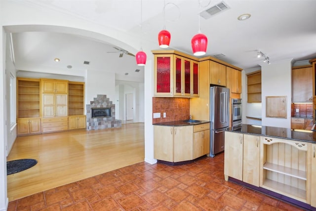 kitchen with stainless steel appliances, open shelves, dark countertops, decorative backsplash, and a ceiling fan