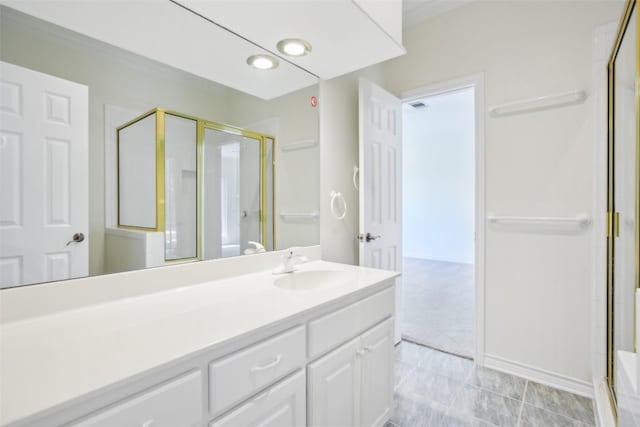 bathroom with a shower stall, vanity, and recessed lighting